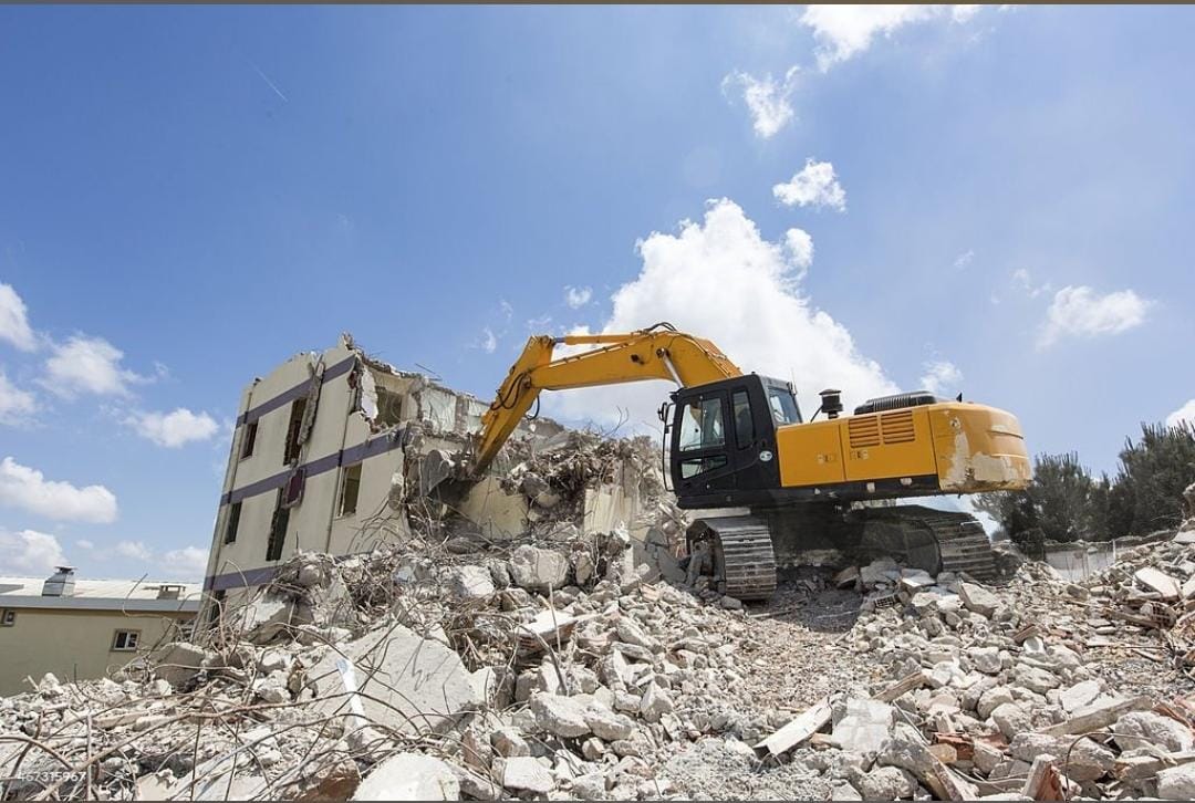 Professional construction and demolition services in UAE with heavy machinery for safe building removal and site preparation